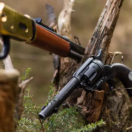 A Winchester style rifle and SAA style revolver and link to our guns of the Wild West collection page