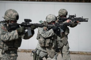 Three US Army soldiers taking aim with rifles – Surplus Store