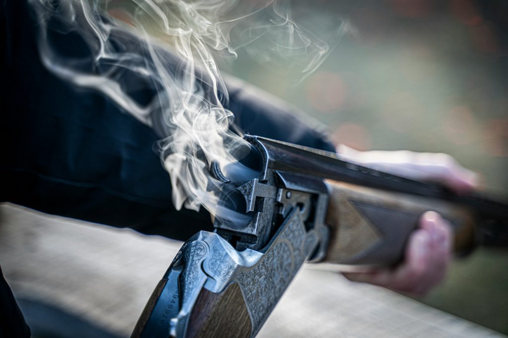 A rifle smoking from the barrel