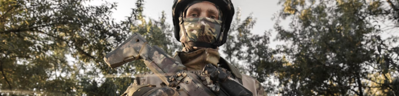 Airsoft player wearing gear and mask