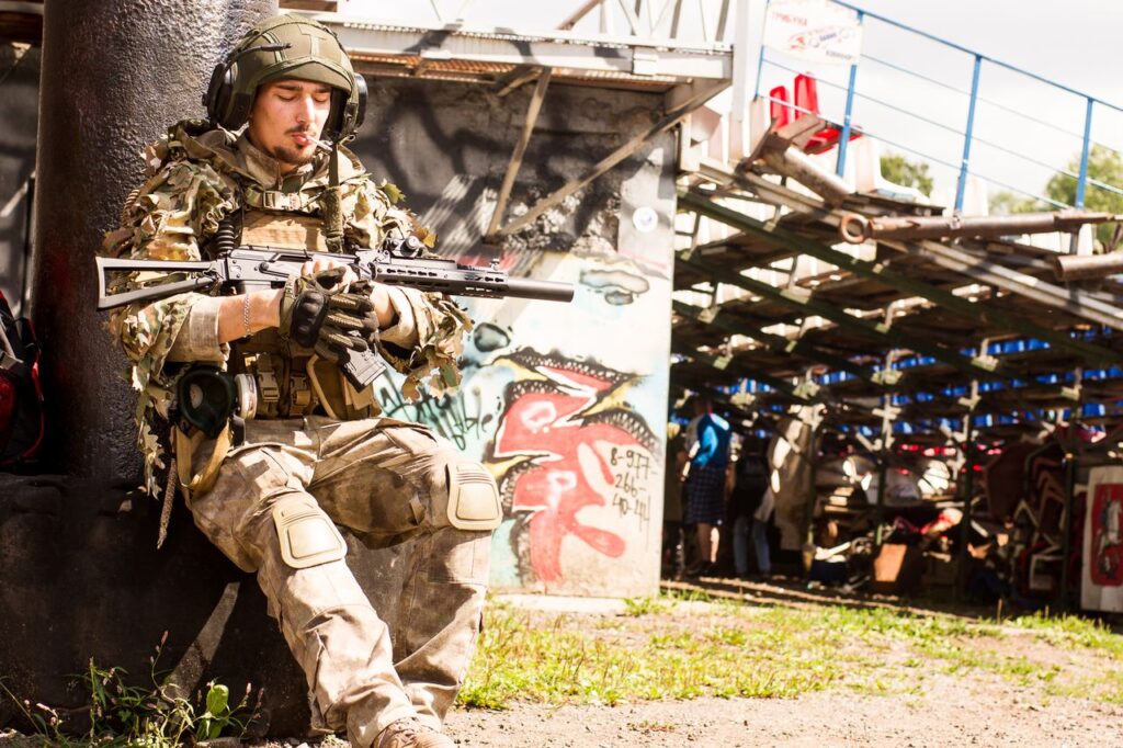Airsoft player wearing knee pads with other protective gear