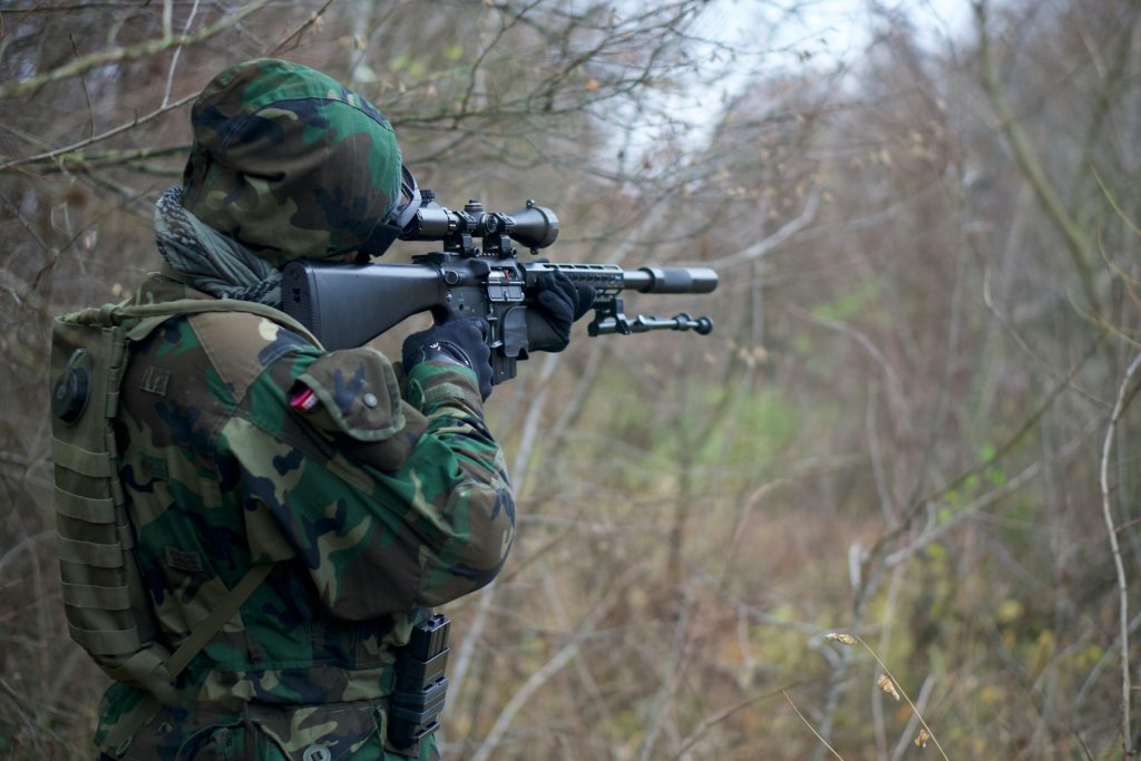 Man aiming airsoft gun