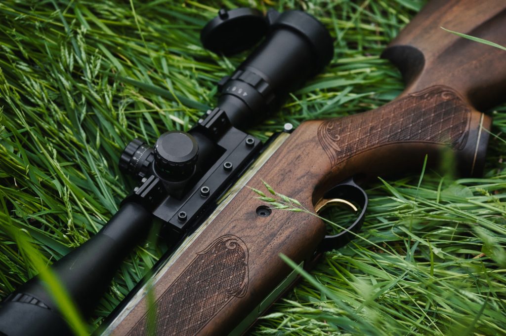 A rifle with a scope mounted on top