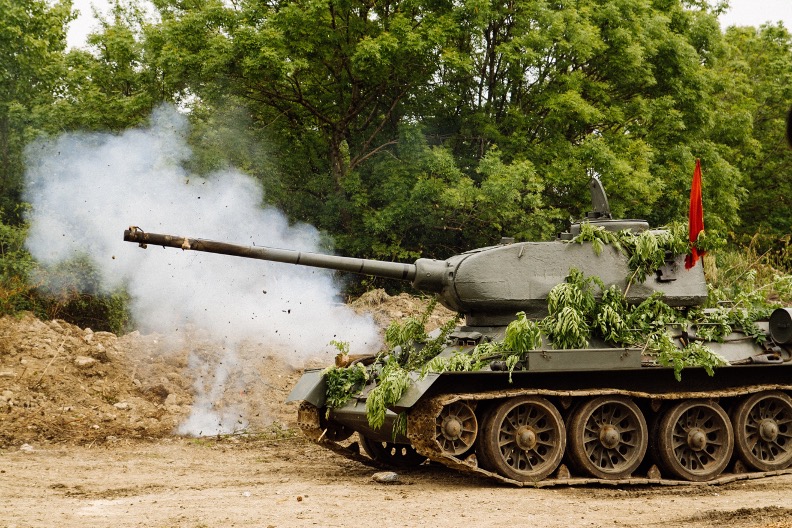 A tank covered in branches