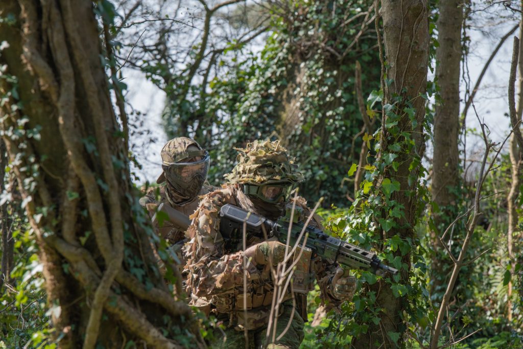 Two airsoft players wearing eye protection