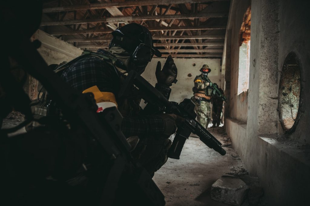 Two airsoft players in an abandoned building