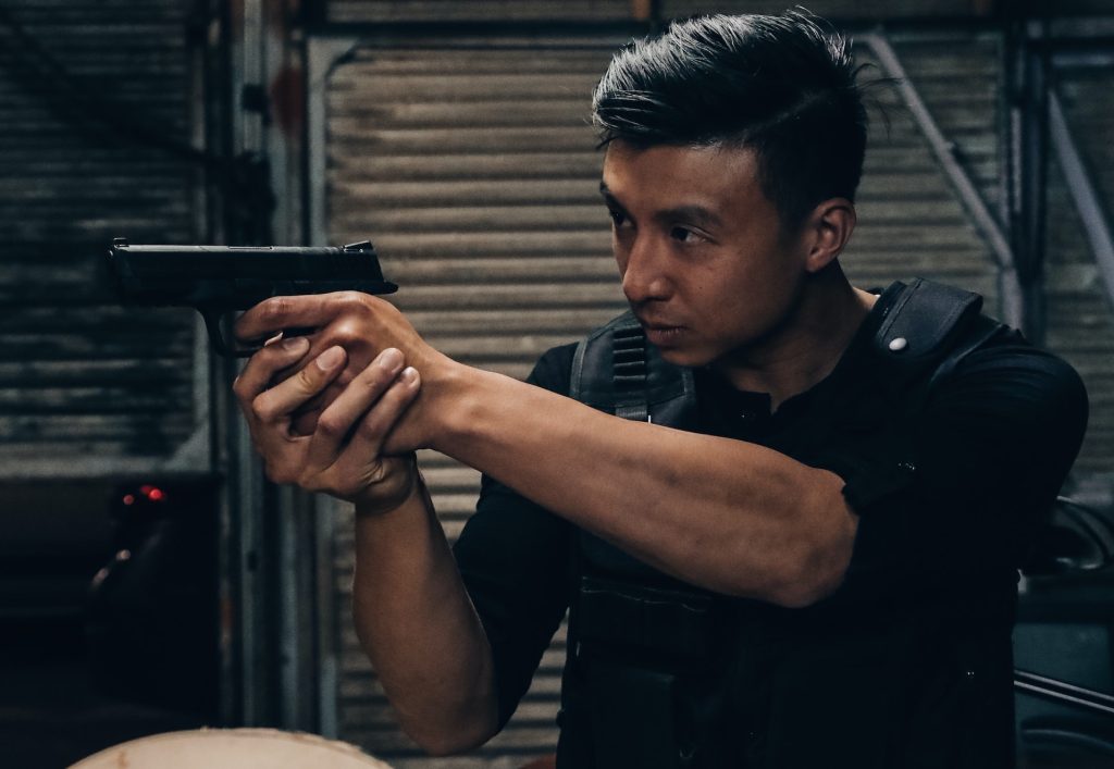 Someone aiming a gun in a training scenario