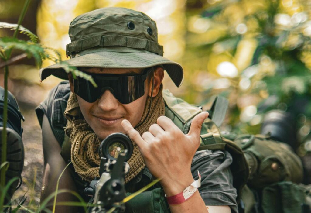 Man wearing hat and protective glasses