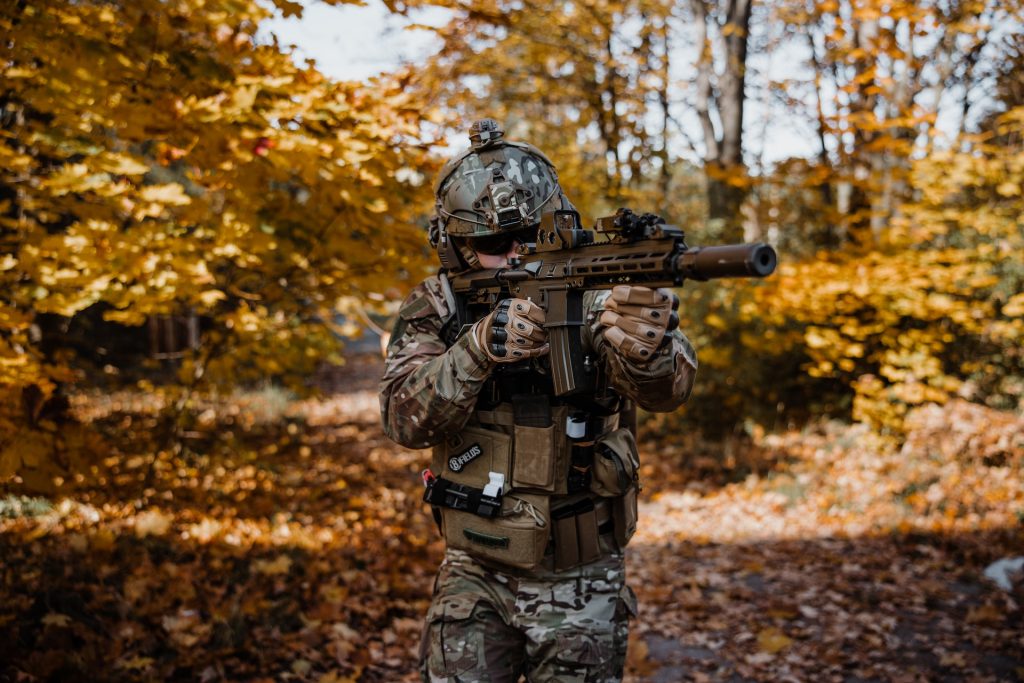 An airsoft player in the woods
