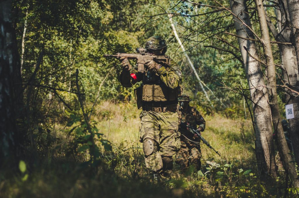 Two airsoft players in the woods