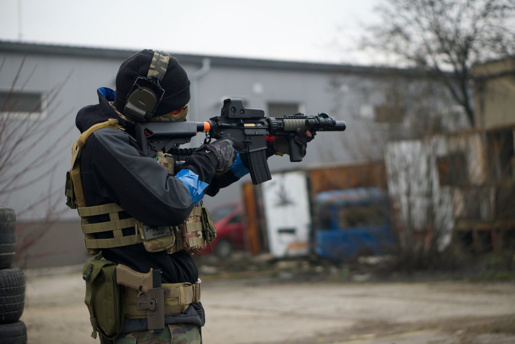 someone holding an airsoft gun