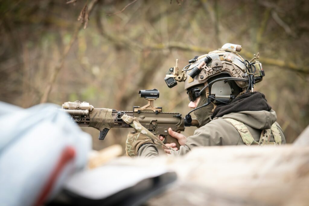 An airsoft player with a rifle