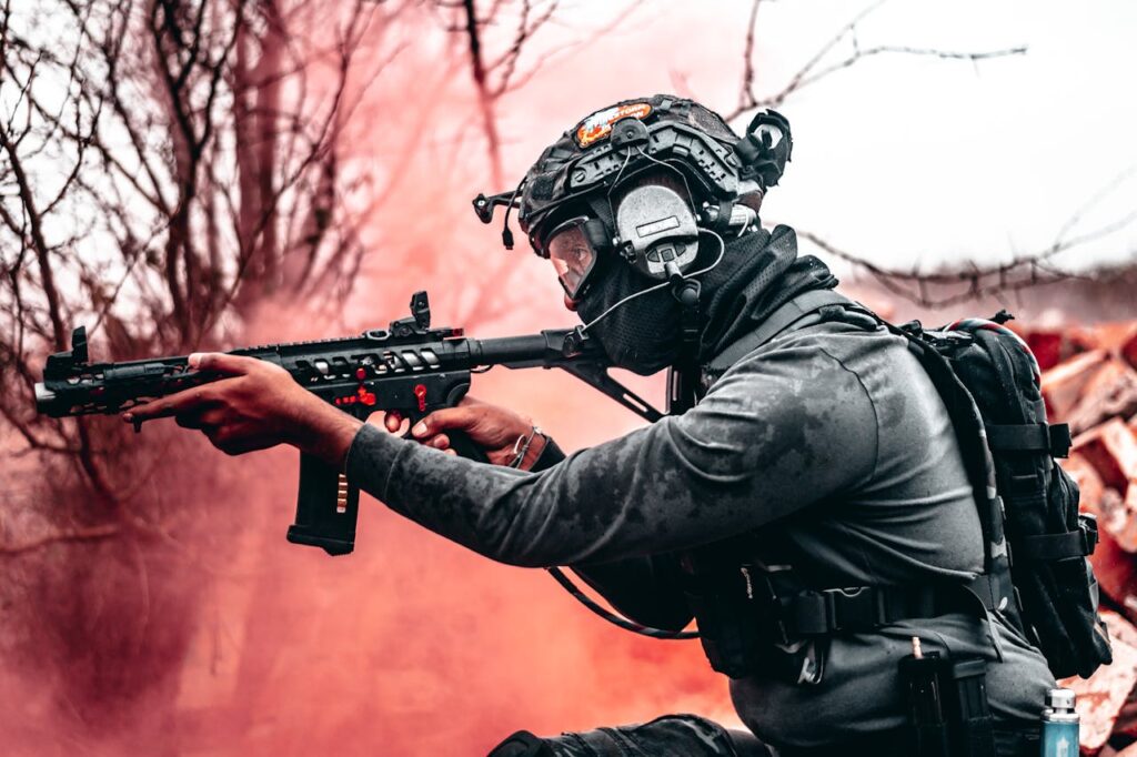 Airsoft play surrounded by red smoke