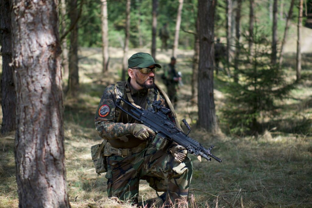 Airsofter players in the woods