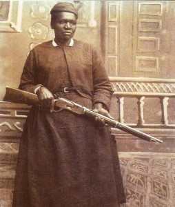 Stagecoach Mary Fields posing with a rifle in hand