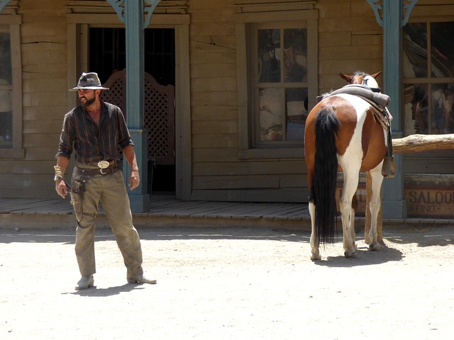 Cowboy in town with horse. 