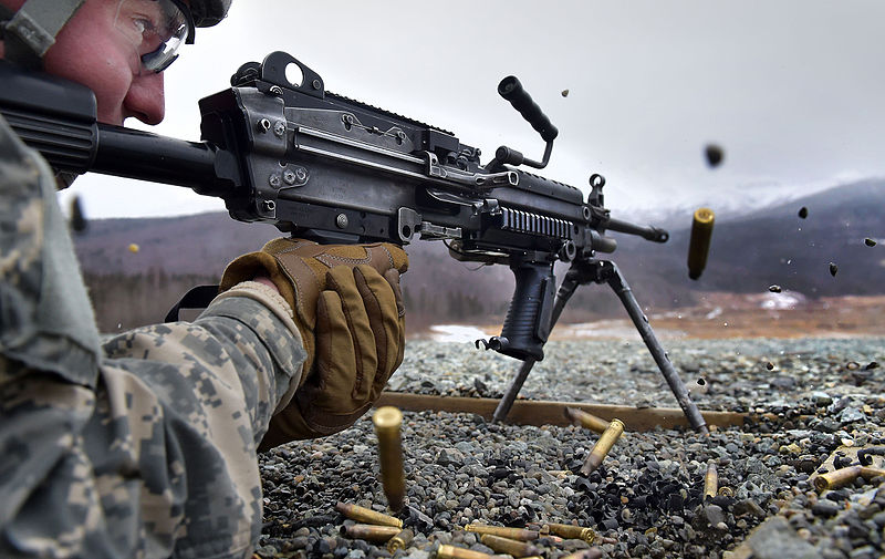 M249 being fired by soldier in prone position. 