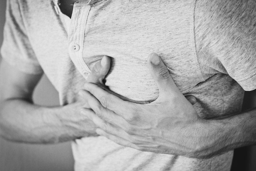 Man clutches heart
