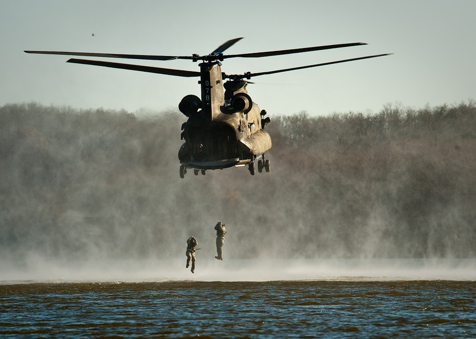 Marines training by jumping out of a helicopter