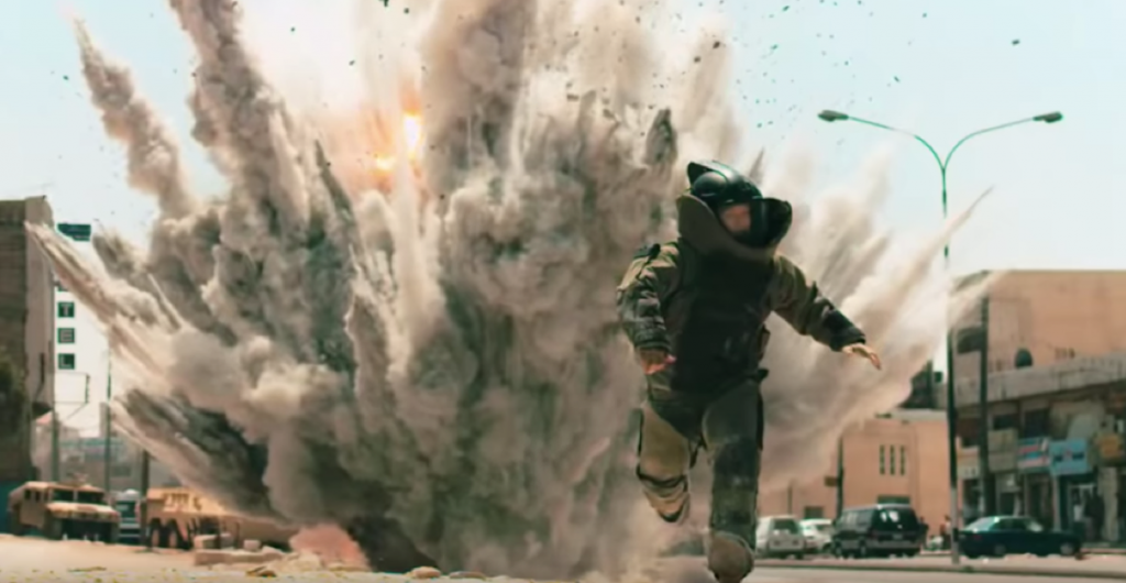 Bomb suit with explosion in background