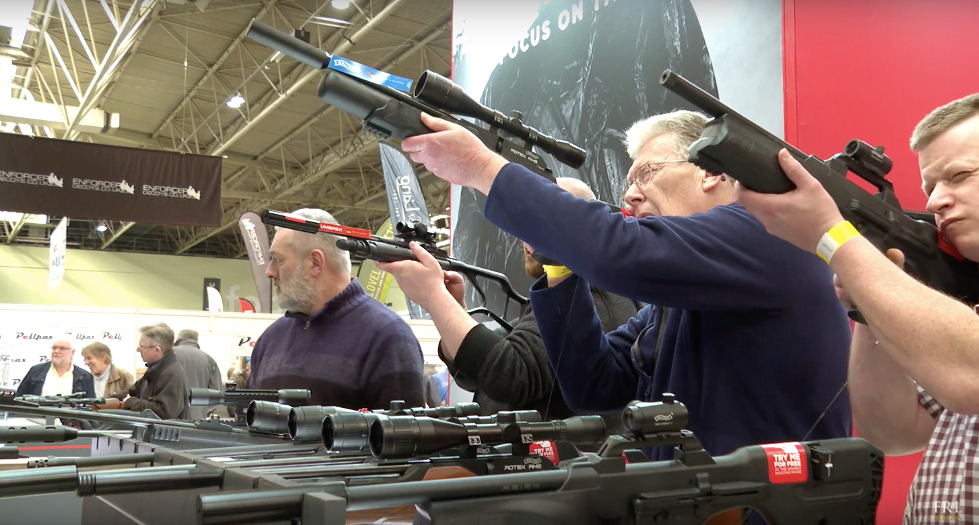 Men aiming down the sights of guns