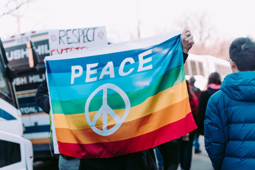 Man holding a peace flag