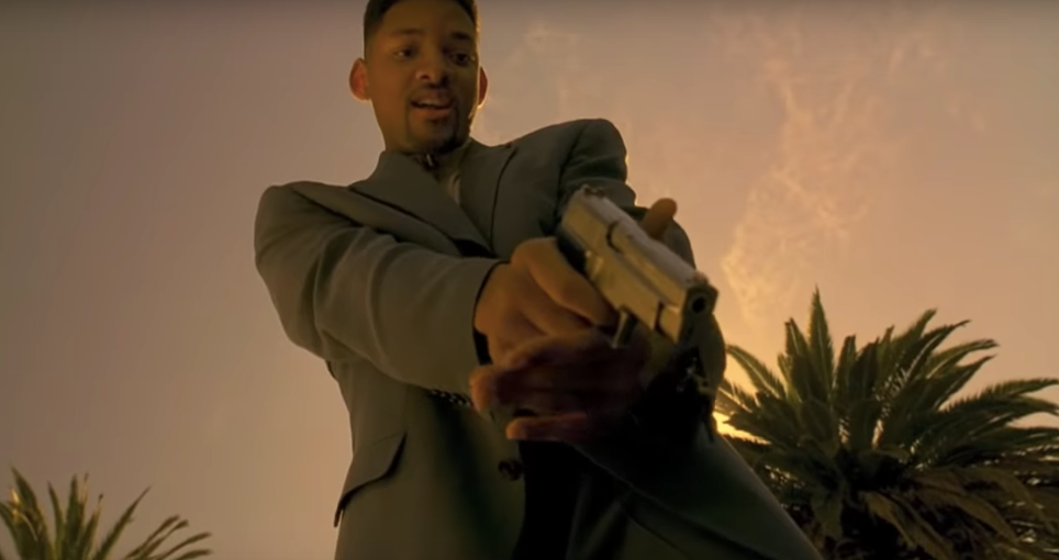 Will smith pointing a pistol downwards