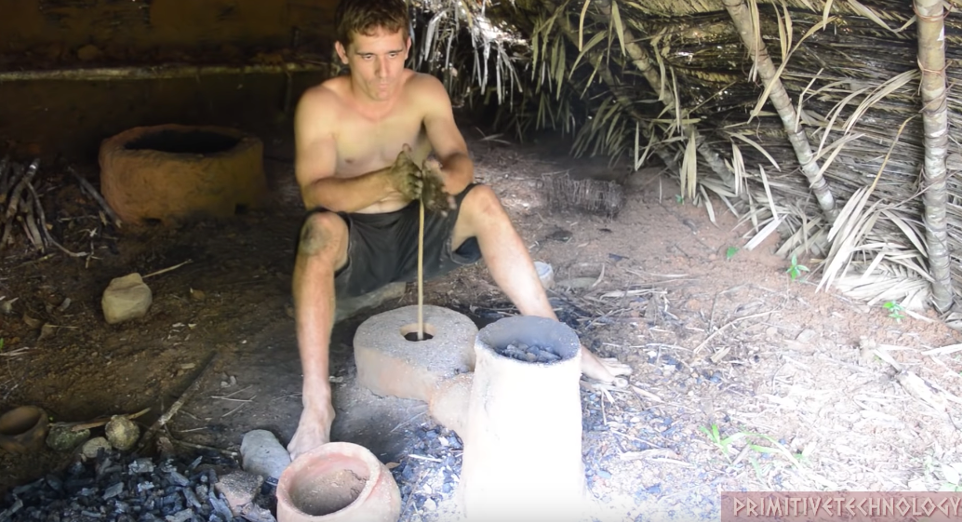 Man making fire with wood