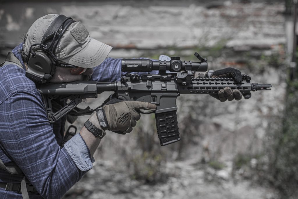 Person firing airsoft rifle